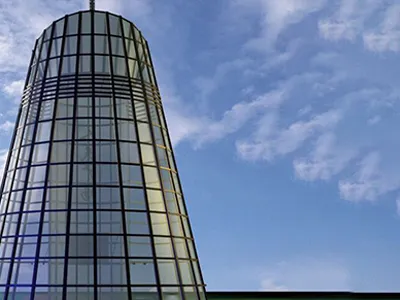 Why are glass curtain walls used all over the world?